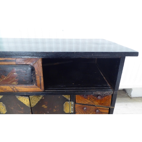 237 - A 20thC Japanese black painted and fruitwood marquetry inlaid table top cabinet with an arrangement ... 