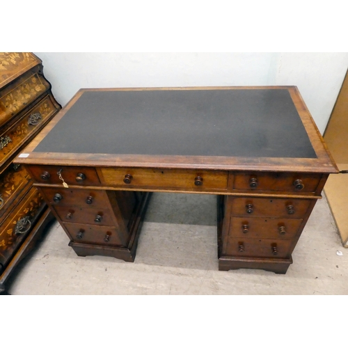 238 - A mid Victorian mahogany nine drawer, twin pedestal desk, raised on bracket feet  30