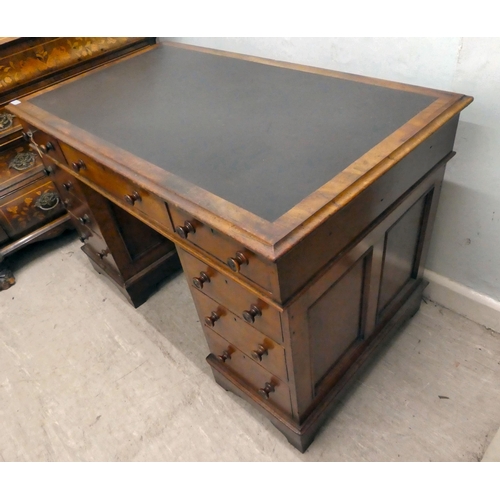 238 - A mid Victorian mahogany nine drawer, twin pedestal desk, raised on bracket feet  30