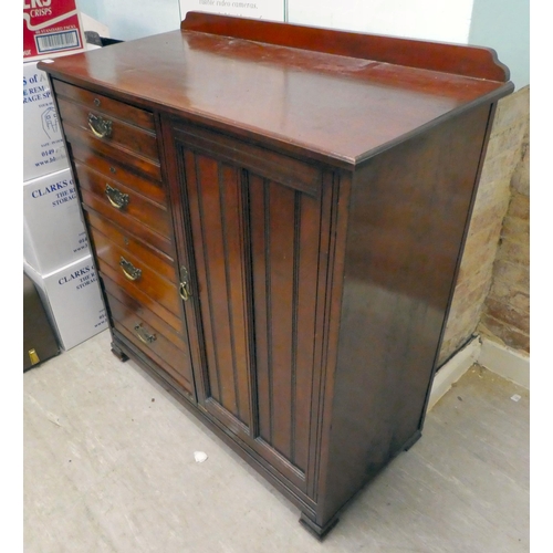 240 - An Edwardian gentleman's mahogany chest, comprising a bank of four offset drawers, beside a panelled... 