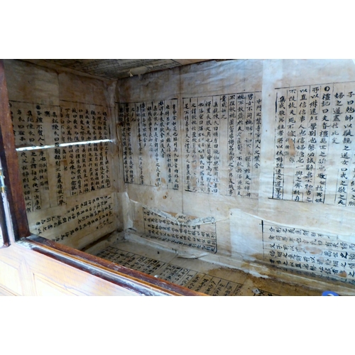 241 - A 20thC Korean brass bound fruitwood chest with an arrangement of cupboard doors and drawers, in two... 