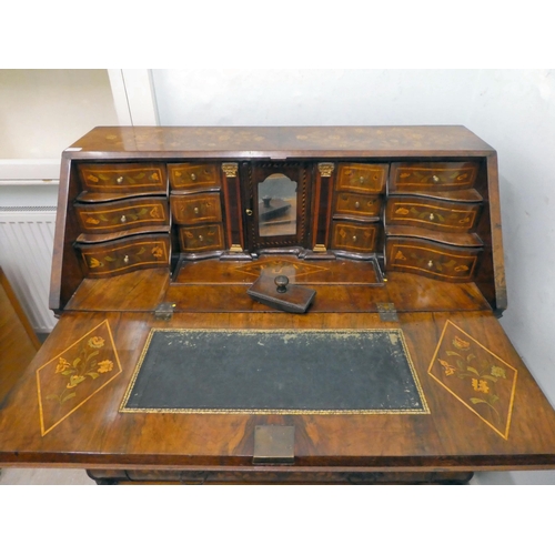 242 - A late 18thC Dutch string inlaid and marquetry bombe front bureau, the fall flap enclosing a similar... 