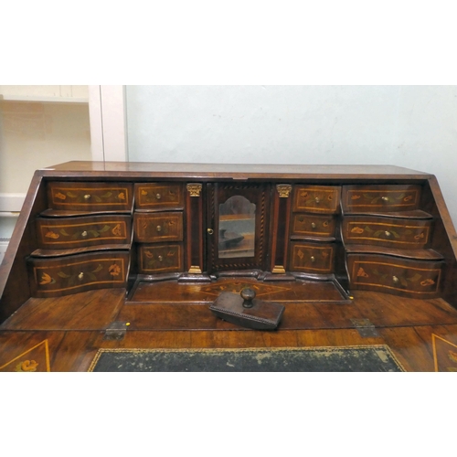 242 - A late 18thC Dutch string inlaid and marquetry bombe front bureau, the fall flap enclosing a similar... 