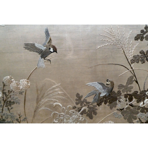 298 - A Chinese embroidered silk panel, depicting birds, trees and fauna  47