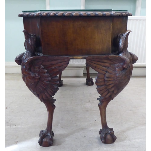 299 - An Edwardian mahogany concave front desk, the top with a gadroon moulded edge, over three drawers, r... 