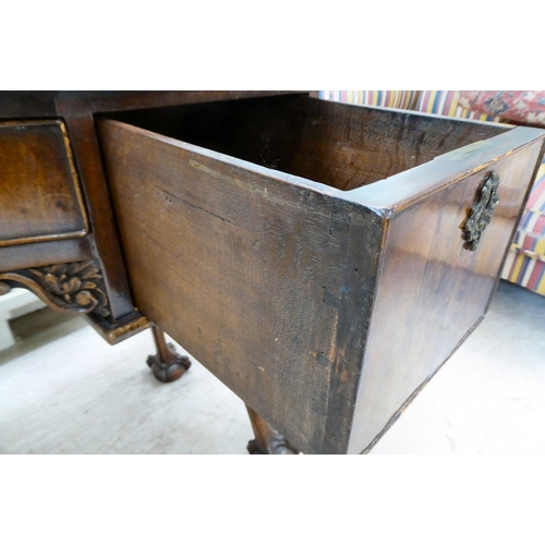 299 - An Edwardian mahogany concave front desk, the top with a gadroon moulded edge, over three drawers, r... 