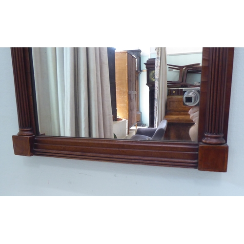 301 - A Regency pier glass, in a satinwood inlaid, mahogany inverted breakfront frame  34