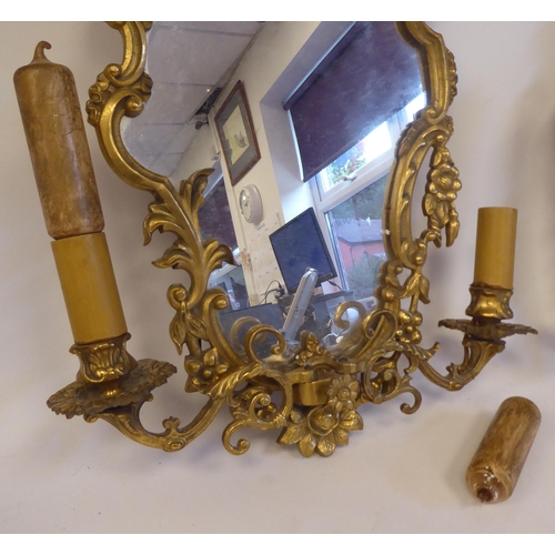 304 - A pair of mid 20thC Rococo design, gilt metal girandole's, each with two adjustable sconces  18... 