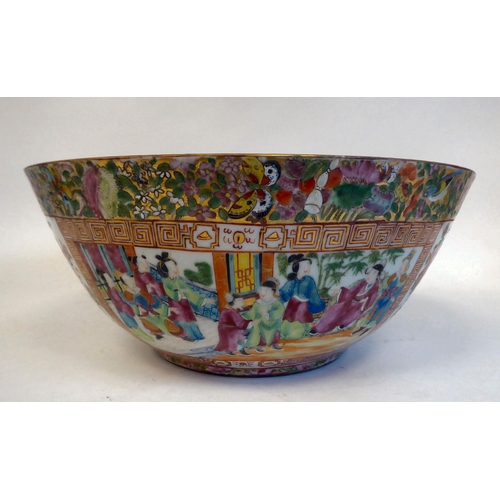 305 - A late 19thC Chinese Canton porcelain bowl, decorated with panels of figures, in a floral border&nbs... 