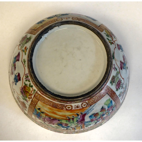 305 - A late 19thC Chinese Canton porcelain bowl, decorated with panels of figures, in a floral border&nbs... 