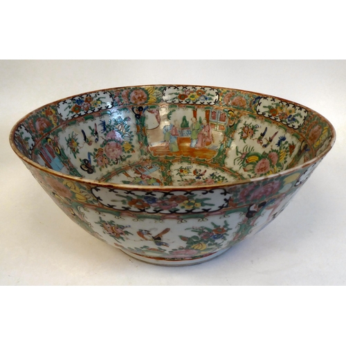 306 - A late 19thC Chinese Canton porcelain bowl, decorated with panels of figures, in a floral border&nbs... 