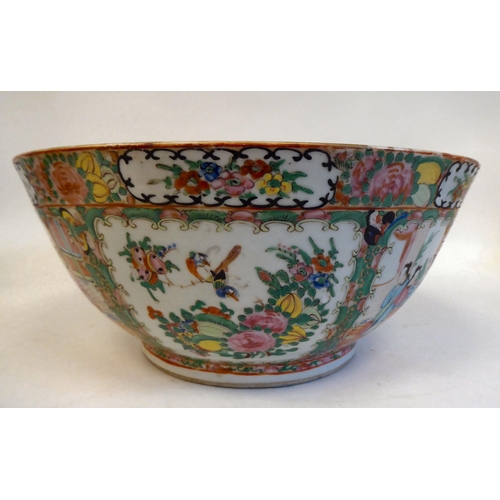 306 - A late 19thC Chinese Canton porcelain bowl, decorated with panels of figures, in a floral border&nbs... 