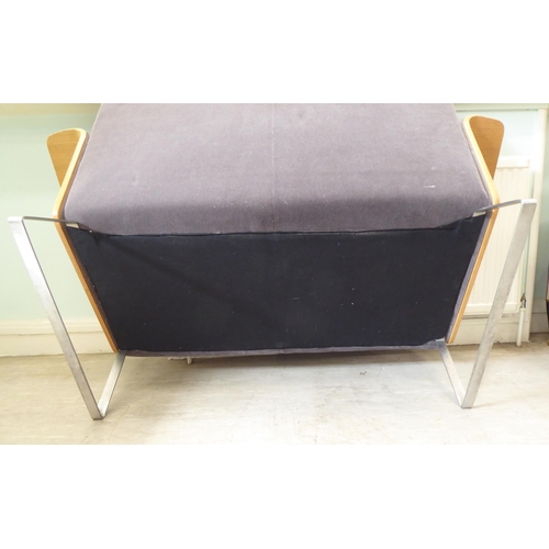 323 - A Robin Day AV2 laminate two person settee, upholstered in a charcoal coloured fabric, raised on chr... 