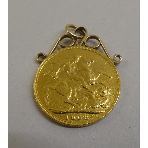 1 - An Edward VII sovereign, St George on the obverse  1908, mounted with a scrolled ring pendant