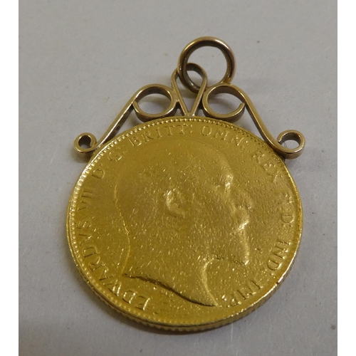 1 - An Edward VII sovereign, St George on the obverse  1908, mounted with a scrolled ring pendant