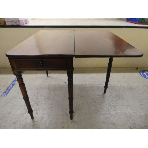 104 - A 19thC mahogany tea table, the foldover top raised on ring turned legs  29