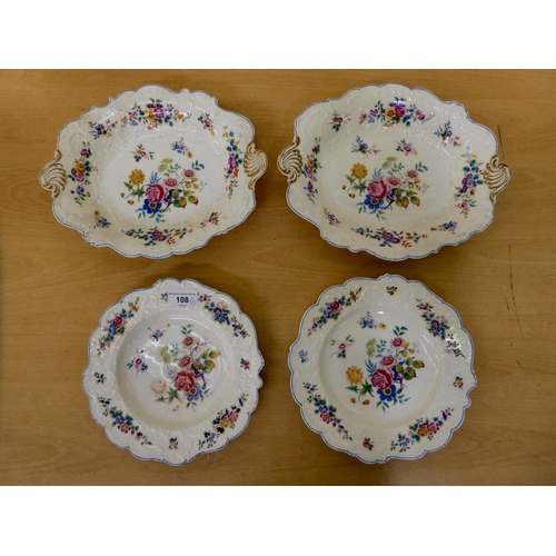 108 - Four items of 20thC china, decorated with flora and a blue trimmed border  comprising two plates  8