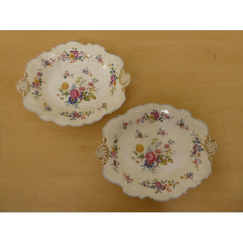 108 - Four items of 20thC china, decorated with flora and a blue trimmed border  comprising two plates  8