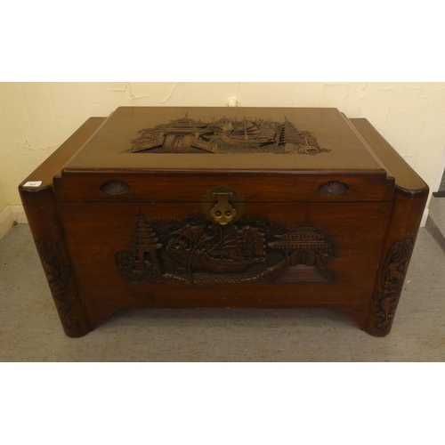 143 - A mid 20thC Chinese camphorwood chest with traditional carvings  22