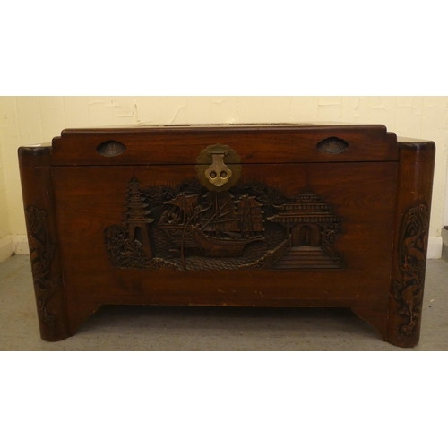 143 - A mid 20thC Chinese camphorwood chest with traditional carvings  22