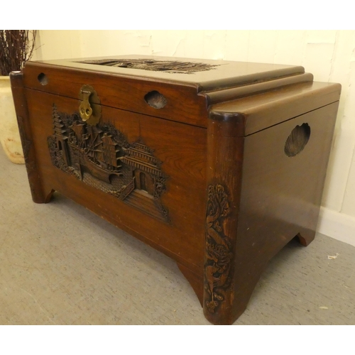 143 - A mid 20thC Chinese camphorwood chest with traditional carvings  22