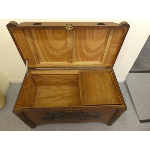 143 - A mid 20thC Chinese camphorwood chest with traditional carvings  22