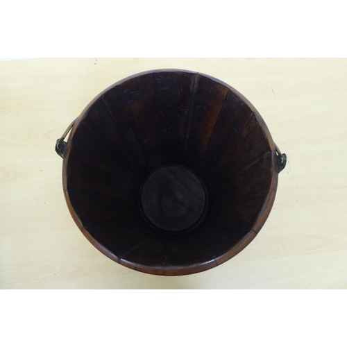 145 - A mid 20thC treen bucket of ribbed, tapered form with an associated brass liner  13