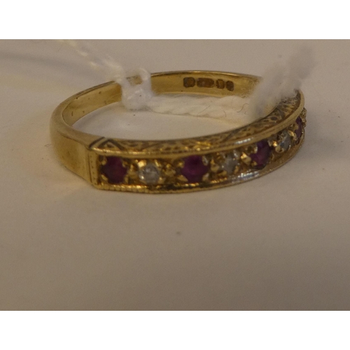 157 - A 9ct gold ruby and diamond set half eternity ring 