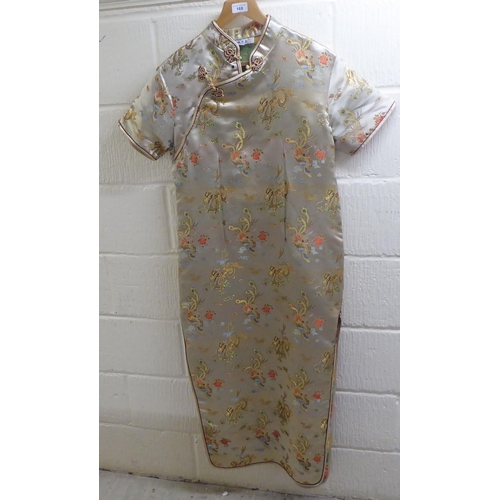 168 - A Chinese silk robe, embroidered with dragons and flowers  size 46