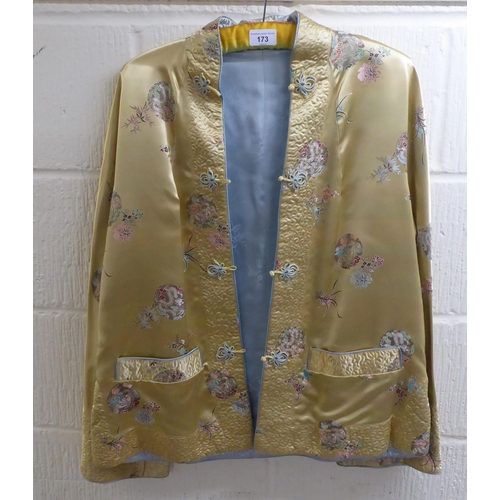 173 - A Chinese silk jacket, embroidered with dragons and flowers  size small