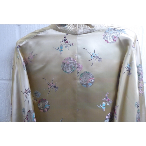 173 - A Chinese silk jacket, embroidered with dragons and flowers  size small