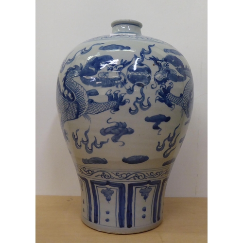 175 - A 20thC Chinese porcelain vase of baluster vase, decorated with Imperial Dragon  bears a six charact... 