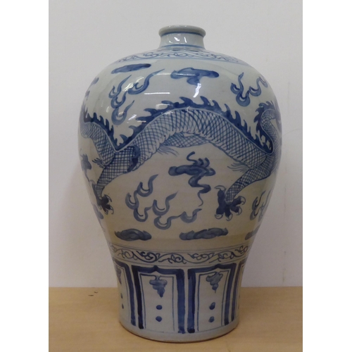 175 - A 20thC Chinese porcelain vase of baluster vase, decorated with Imperial Dragon  bears a six charact... 