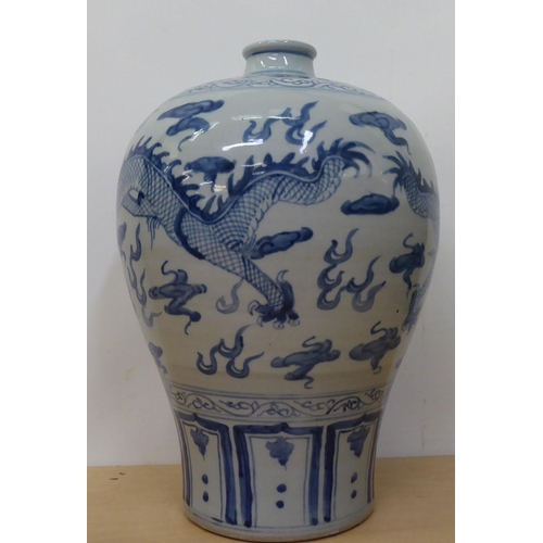 175 - A 20thC Chinese porcelain vase of baluster vase, decorated with Imperial Dragon  bears a six charact... 