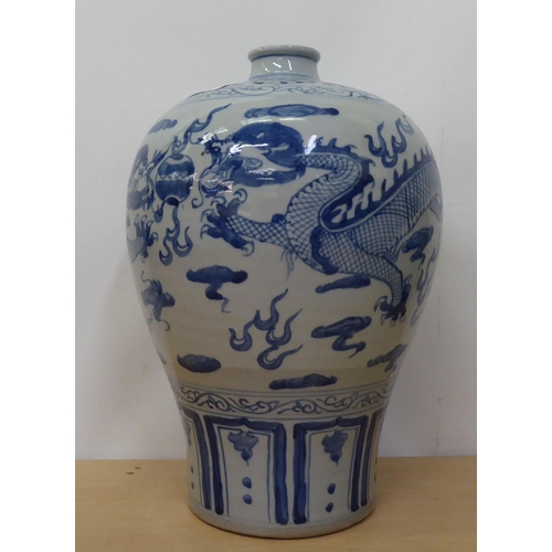 175 - A 20thC Chinese porcelain vase of baluster vase, decorated with Imperial Dragon  bears a six charact... 