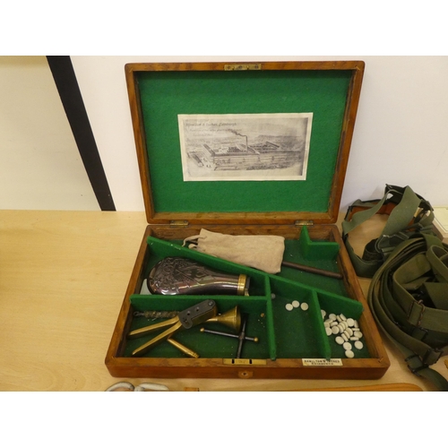 176 - Military collectables: to include a cast metal shot flask(Please Note: this lot is subject to the st... 