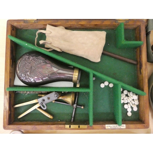 176 - Military collectables: to include a cast metal shot flask(Please Note: this lot is subject to the st... 