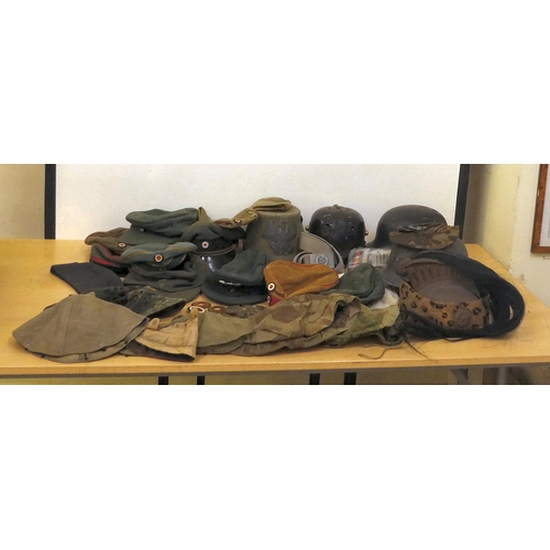 181 - Military hats and caps, mostly replicas: to include German examples(Please Note: this lot is subject... 