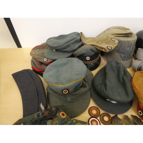 181 - Military hats and caps, mostly replicas: to include German examples(Please Note: this lot is subject... 