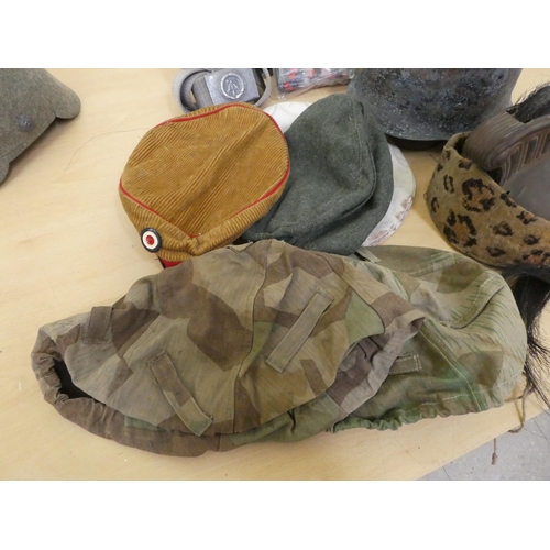 181 - Military hats and caps, mostly replicas: to include German examples(Please Note: this lot is subject... 