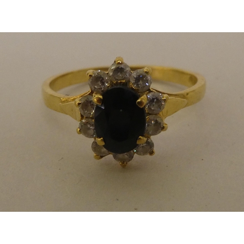 186 - An 18ct gold diamond and sapphire cluster ring