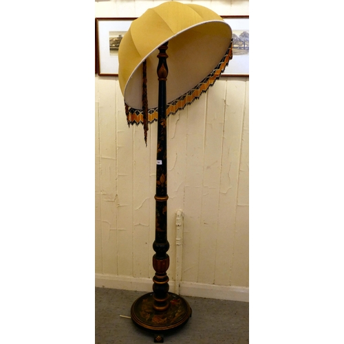 196 - A mid 20thC Oriental black and gilt painted standard lamp, decorated in traditional taste with figur... 