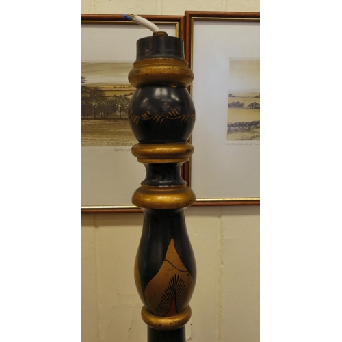 196 - A mid 20thC Oriental black and gilt painted standard lamp, decorated in traditional taste with figur... 