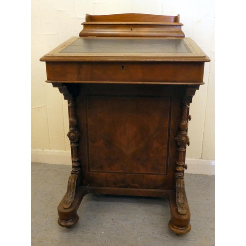 197 - An Edwardian walnut and mahogany Davenport with a hinged top and a galleried compartment, over a ban... 