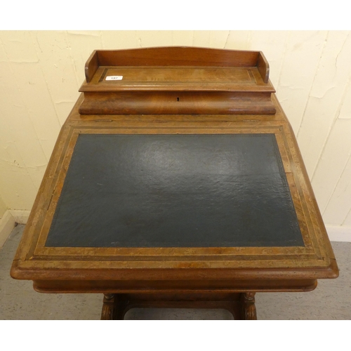 197 - An Edwardian walnut and mahogany Davenport with a hinged top and a galleried compartment, over a ban... 