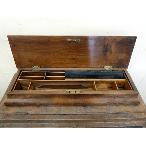 197 - An Edwardian walnut and mahogany Davenport with a hinged top and a galleried compartment, over a ban... 