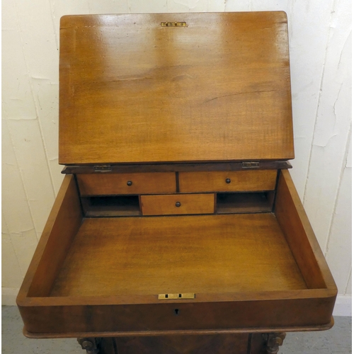 197 - An Edwardian walnut and mahogany Davenport with a hinged top and a galleried compartment, over a ban... 