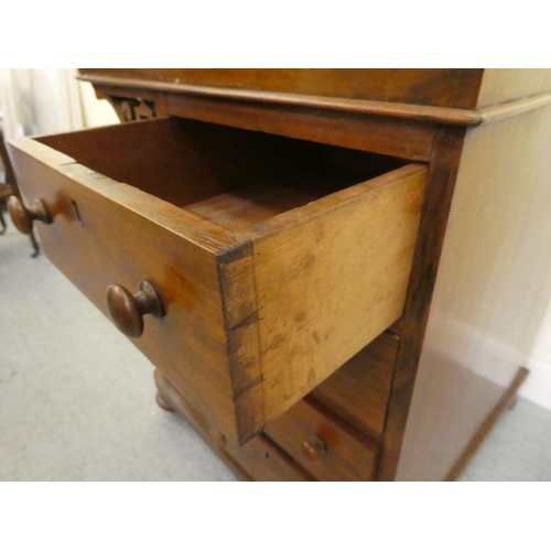 197 - An Edwardian walnut and mahogany Davenport with a hinged top and a galleried compartment, over a ban... 