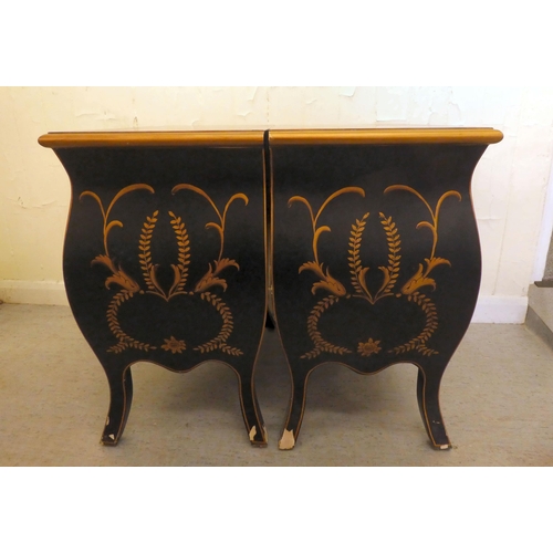 198 - A pair of modern black painted and gilt stencilled two drawer bedside chests, raised on splayed legs... 