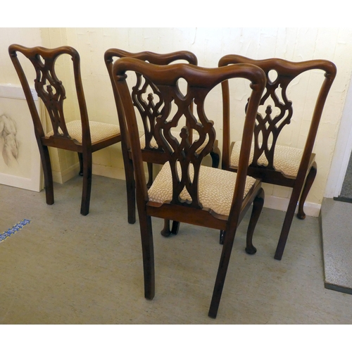 199 - A set of four early 20thC Chippendale design mahogany framed dining chairs with later fabric upholst... 